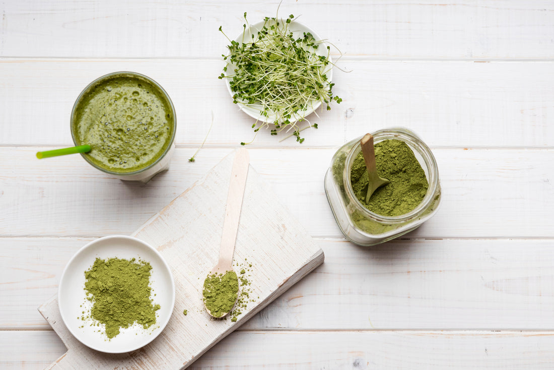 Top view of natural green skincare products in glass containers
